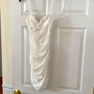 Hello Molly. Never worn but no tags. White sequence minidress with ruching. US 4